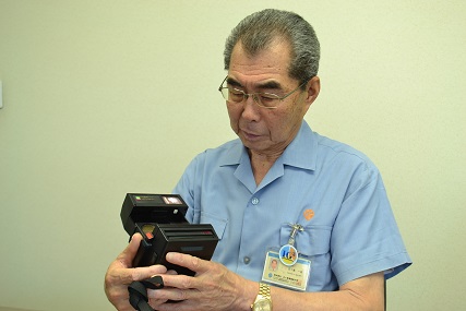  Adopted Polaroid camera and Chairman Kazuharu Igarashi